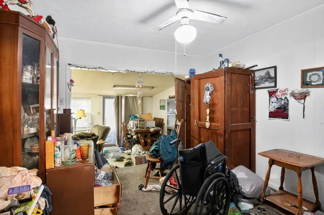 a very nice looking room with many windows and furniture