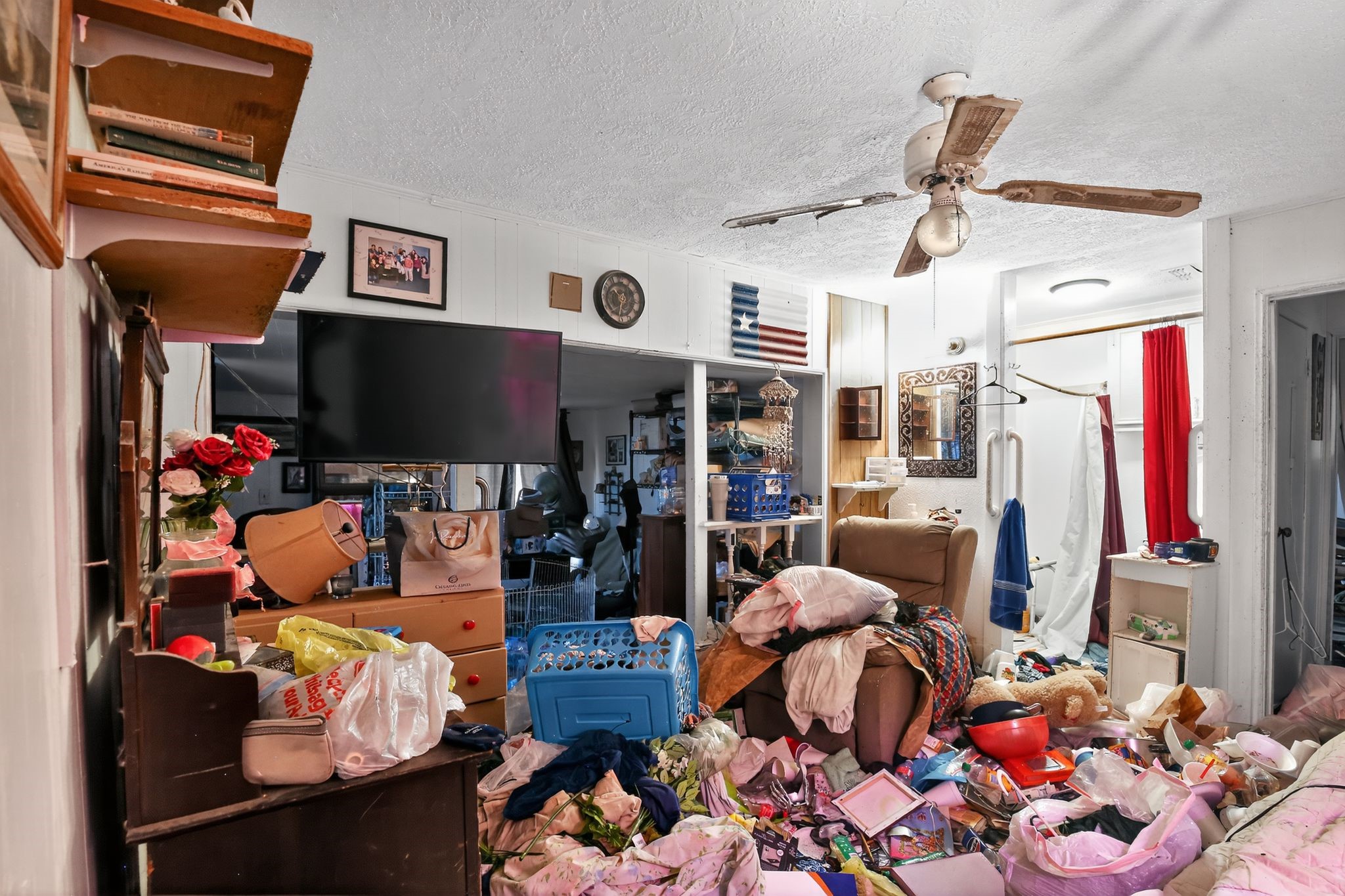2319 Woodville Road Bryan, TX 77803 - Photo 8 of 15 a living room with lots of furniture and a flat screen tv