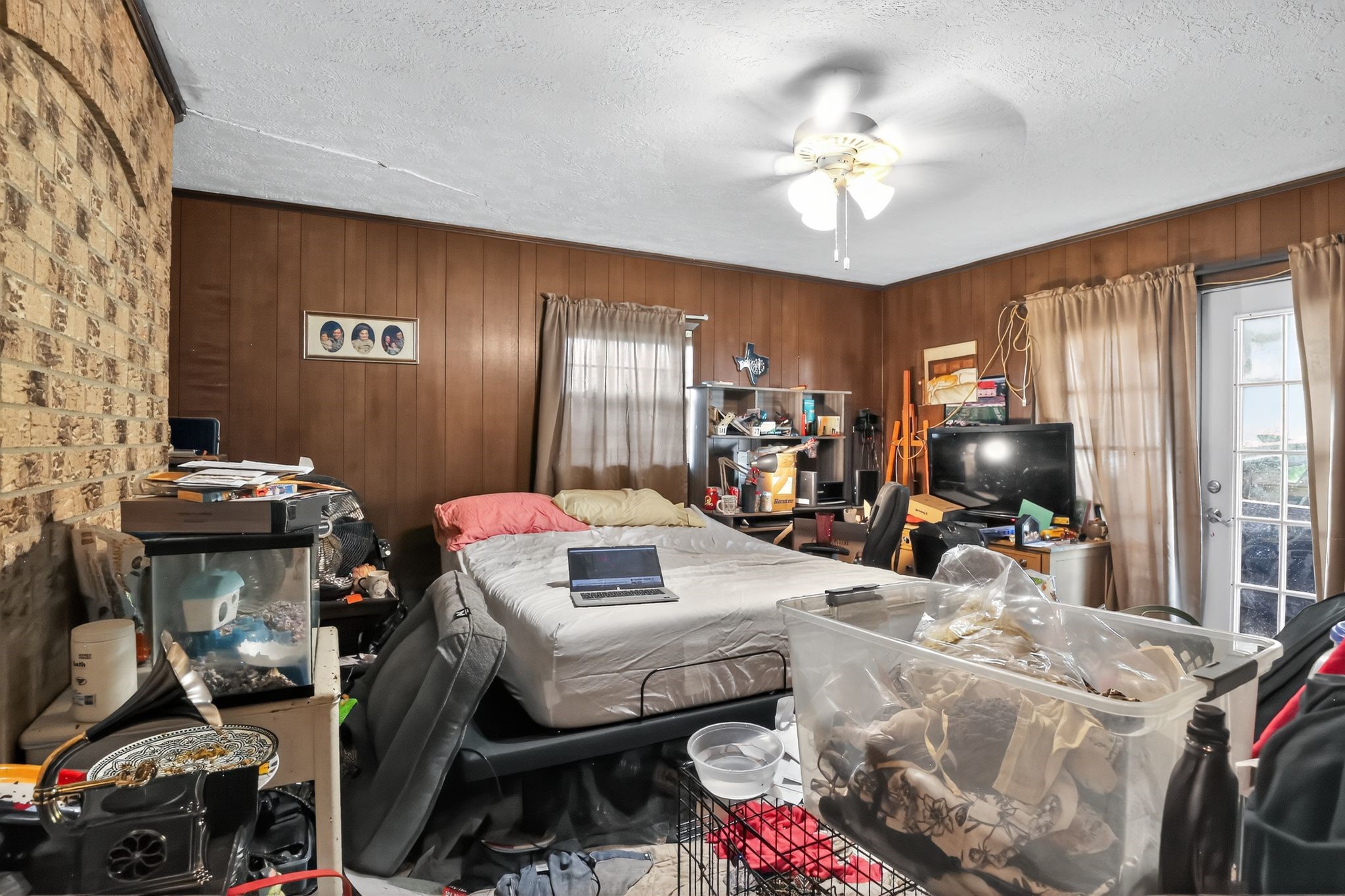 2319 Woodville Road Bryan, TX 77803 - Photo 10 of 15 a living room with furniture and a chandelier