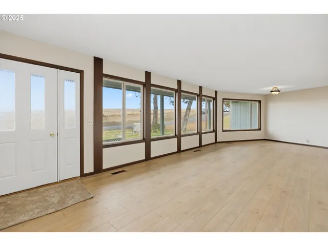 a view of an empty room with windows