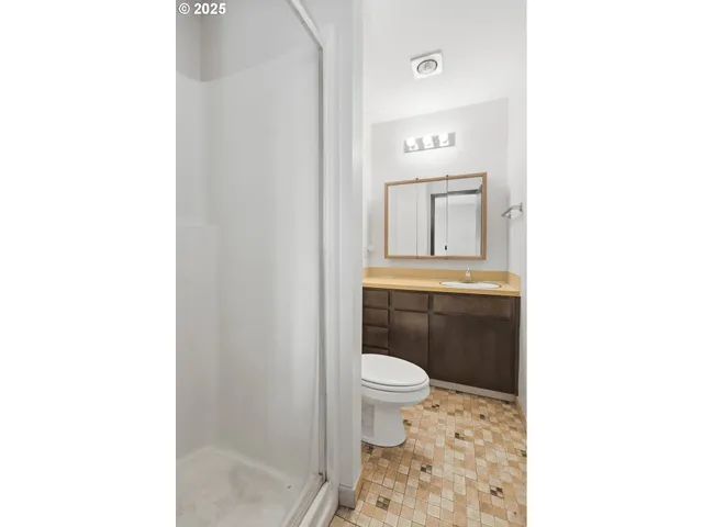 a bathroom with a sink a toilet and mirror