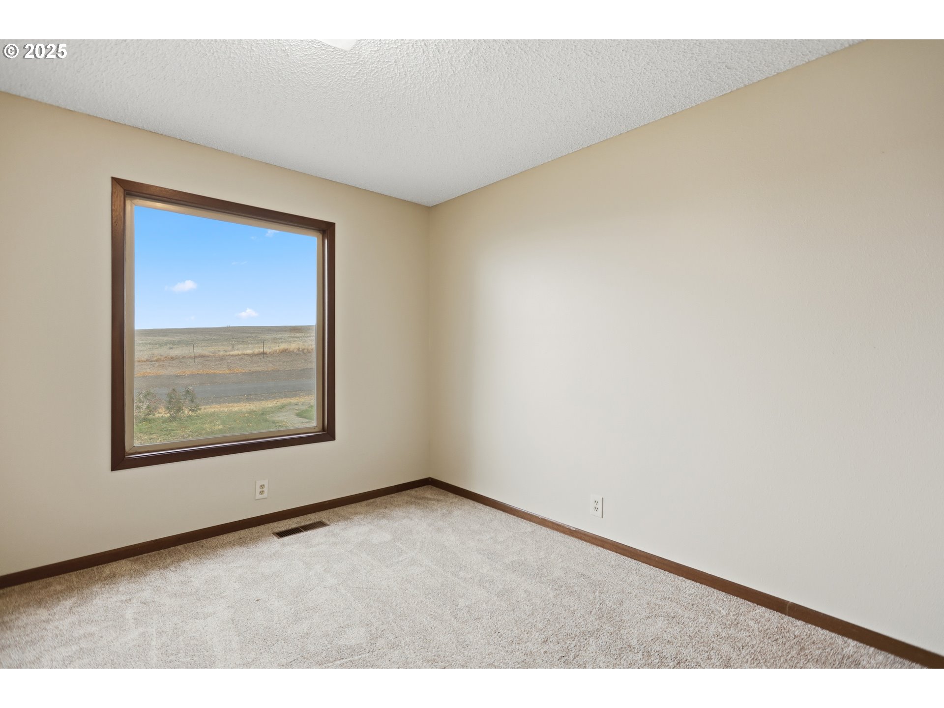 512 6th Street Wasco, OR 97065 - Photo 26 of 45 a view of an empty room with a window