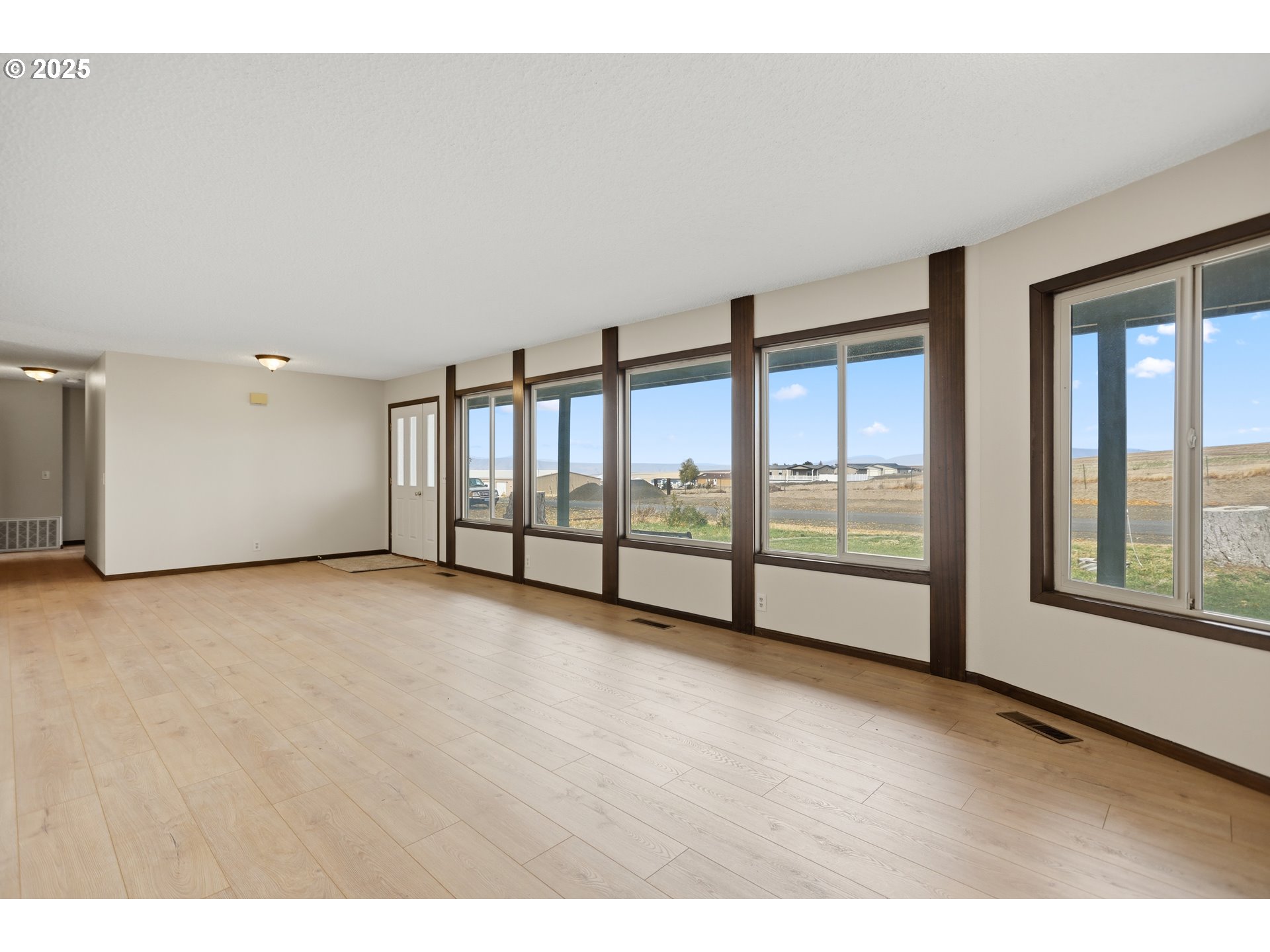 512 6th Street Wasco, OR 97065 - Photo 4 of 45 a view of an empty room with windows