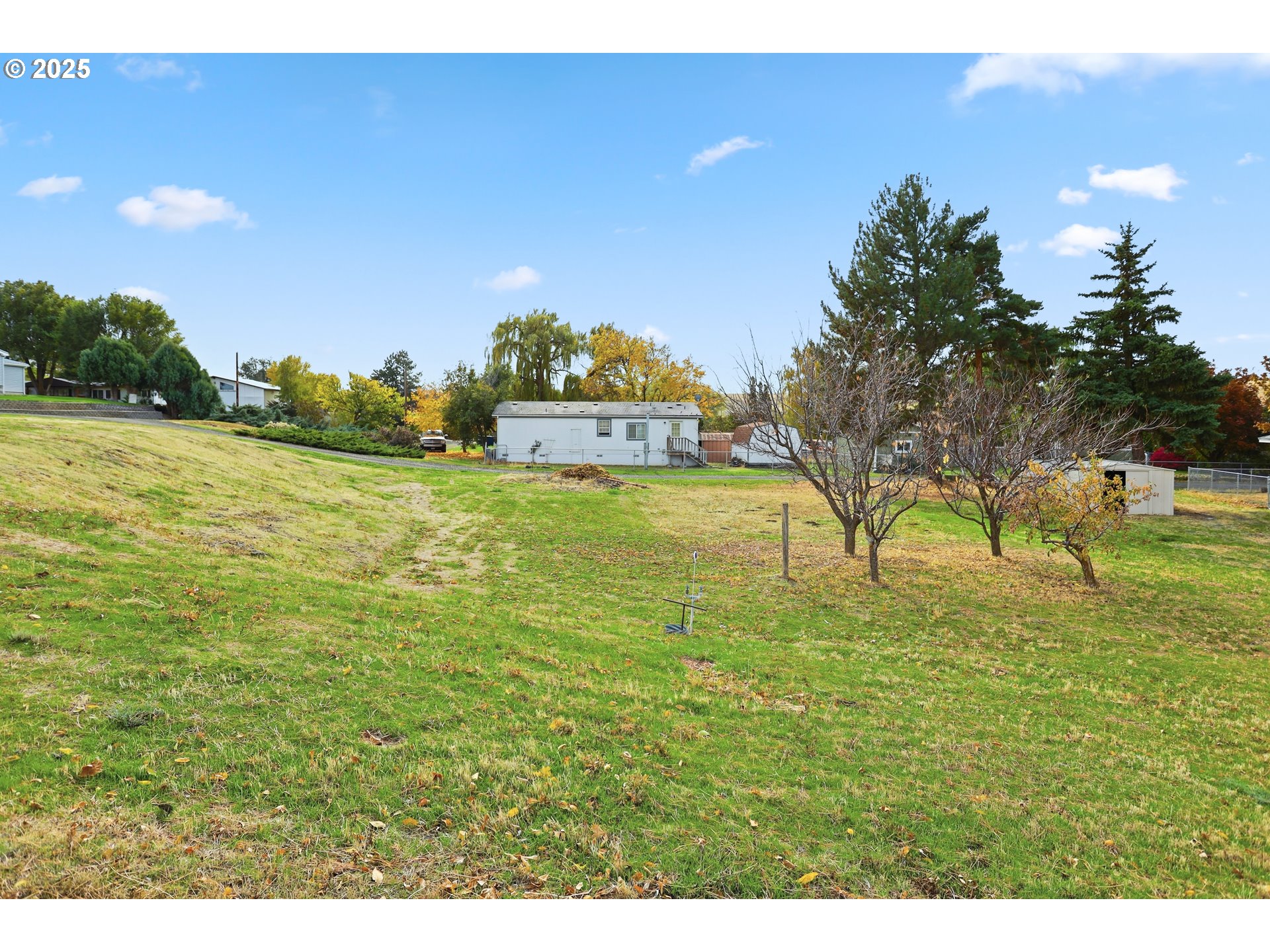 512 6th Street Wasco, OR 97065 - Photo 42 of 45 a view of a large yard with an ocean view