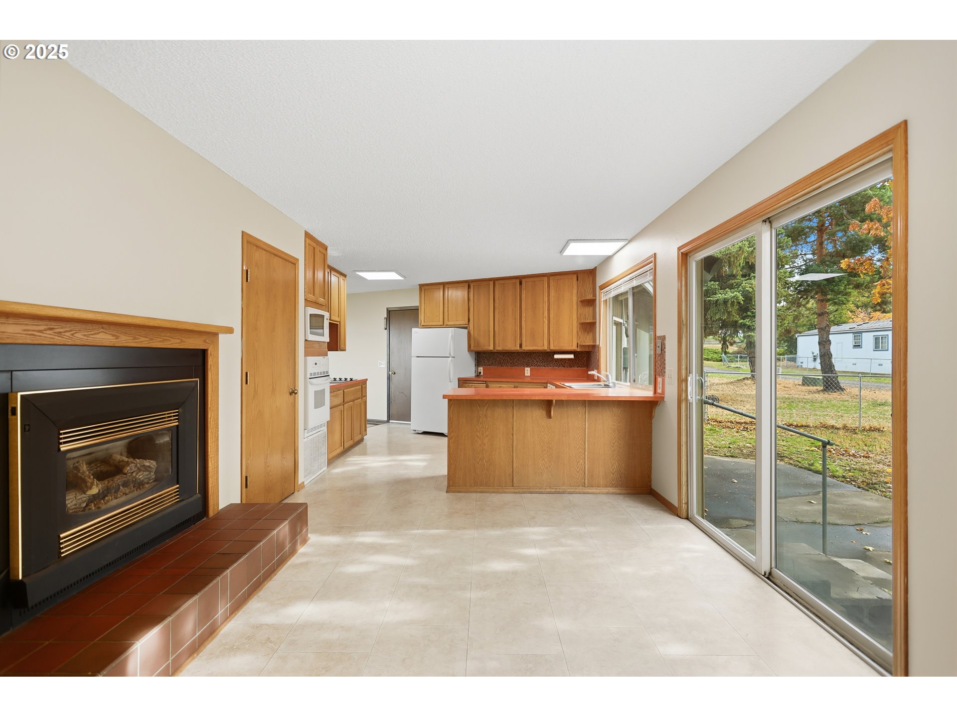 512 6th Street Wasco, OR 97065 - Photo 10 of 45 a kitchen with a refrigerator and a stove top oven