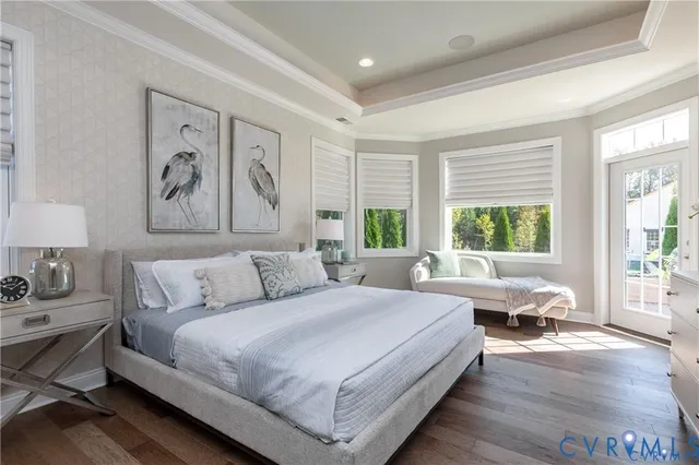 a bed room with a bed and a large window