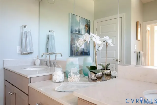 a bathroom with sink and mirror