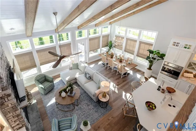 a living room with furniture and a floor to ceiling window