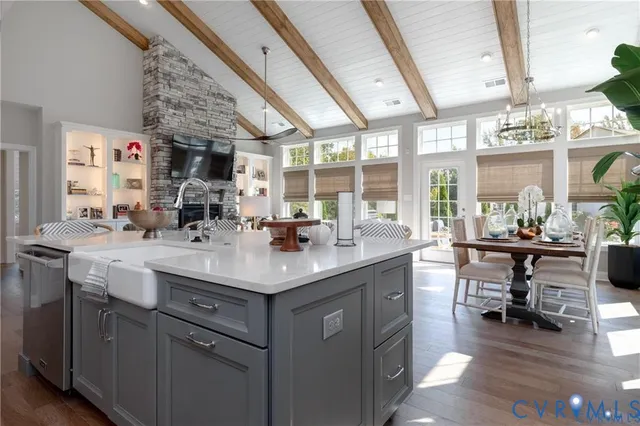 a kitchen with a sink appliances and a counter top space