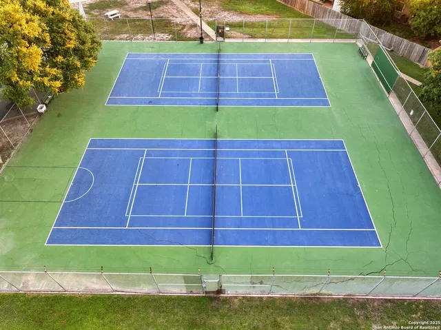 an aerial view of a house with a garden