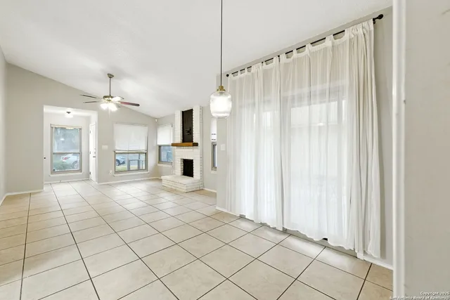 a view of a kitchen with an entryway and a window