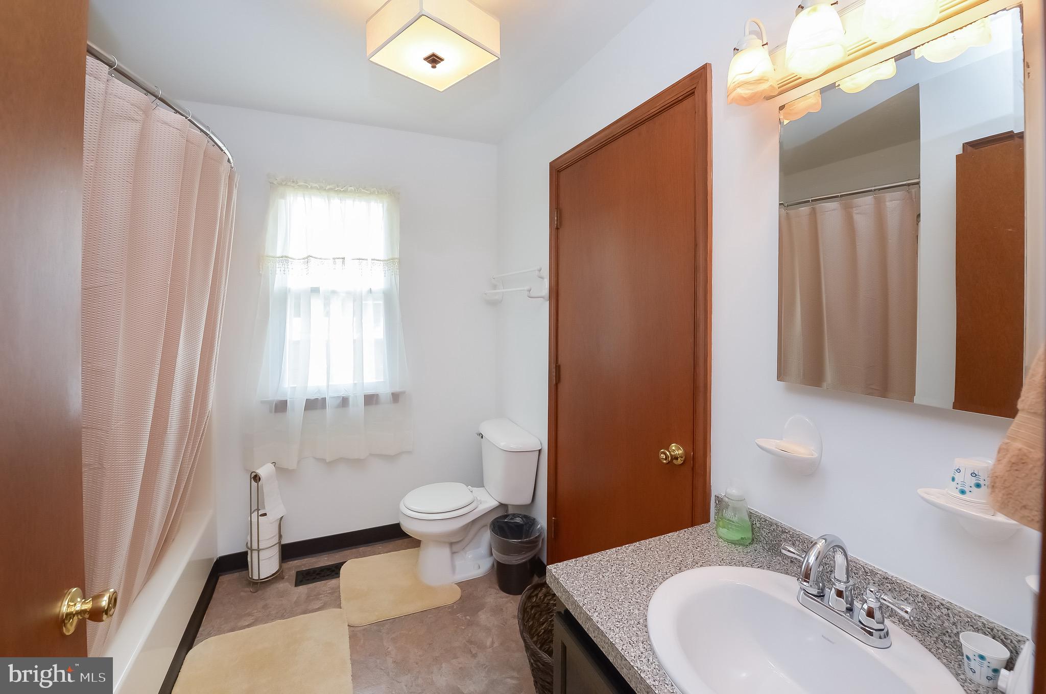 618 Ridgeway Street Gloucester City, NJ 08030 - Photo 22 of 26 a bathroom with a sink toilet and shower