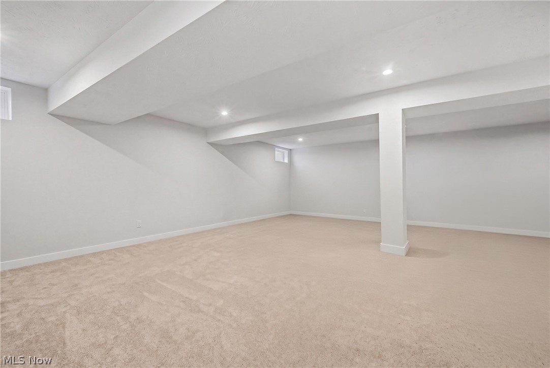 5358 Walnut Rdg Lane Sheffield Lake, OH 44054 - Photo 36 of 50 Spacious room featuring light-colored carpeting, white painted walls, recessed lighting, and a structural column