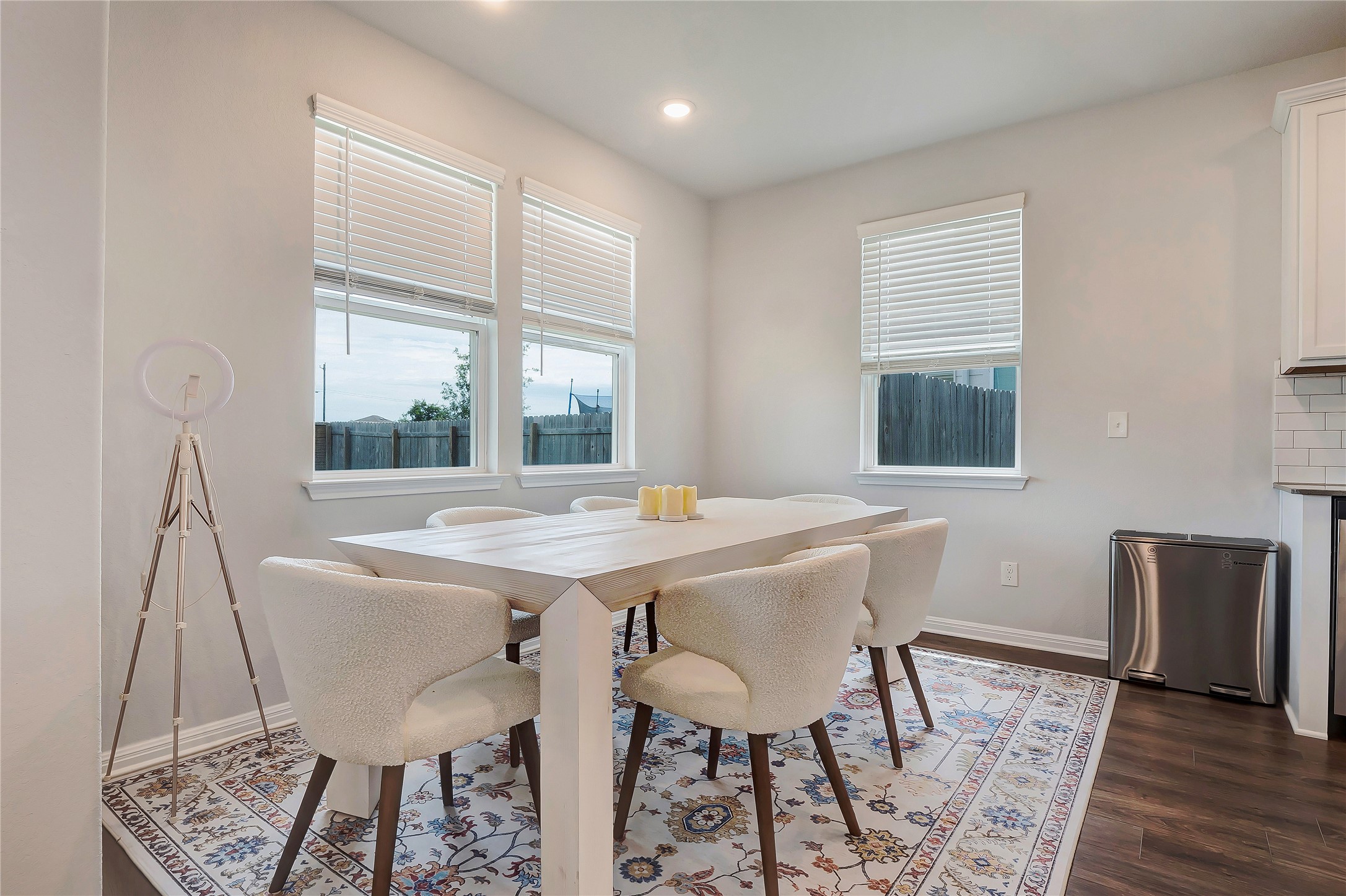 6554 Marsh Lane Buda, TX 78610 - Photo 11 of 30 a view of a dining room with furniture window and wooden floor