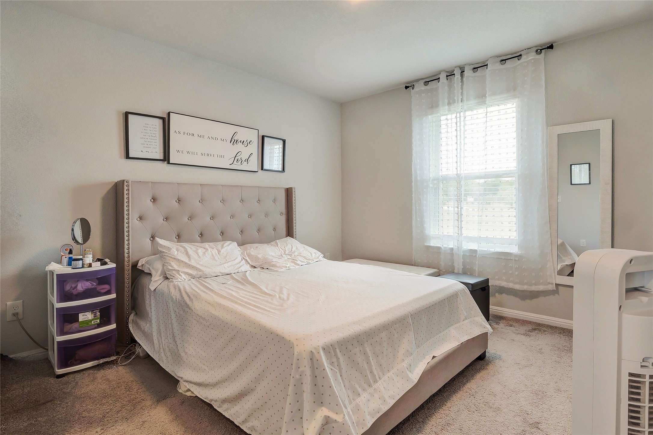 6554 Marsh Lane Buda, TX 78610 - Photo 16 of 30 a bedroom with a bed and a window