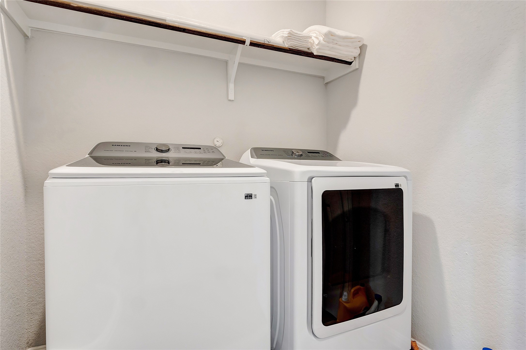 6554 Marsh Lane Buda, TX 78610 - Photo 18 of 30 a utility room with dryer and washer