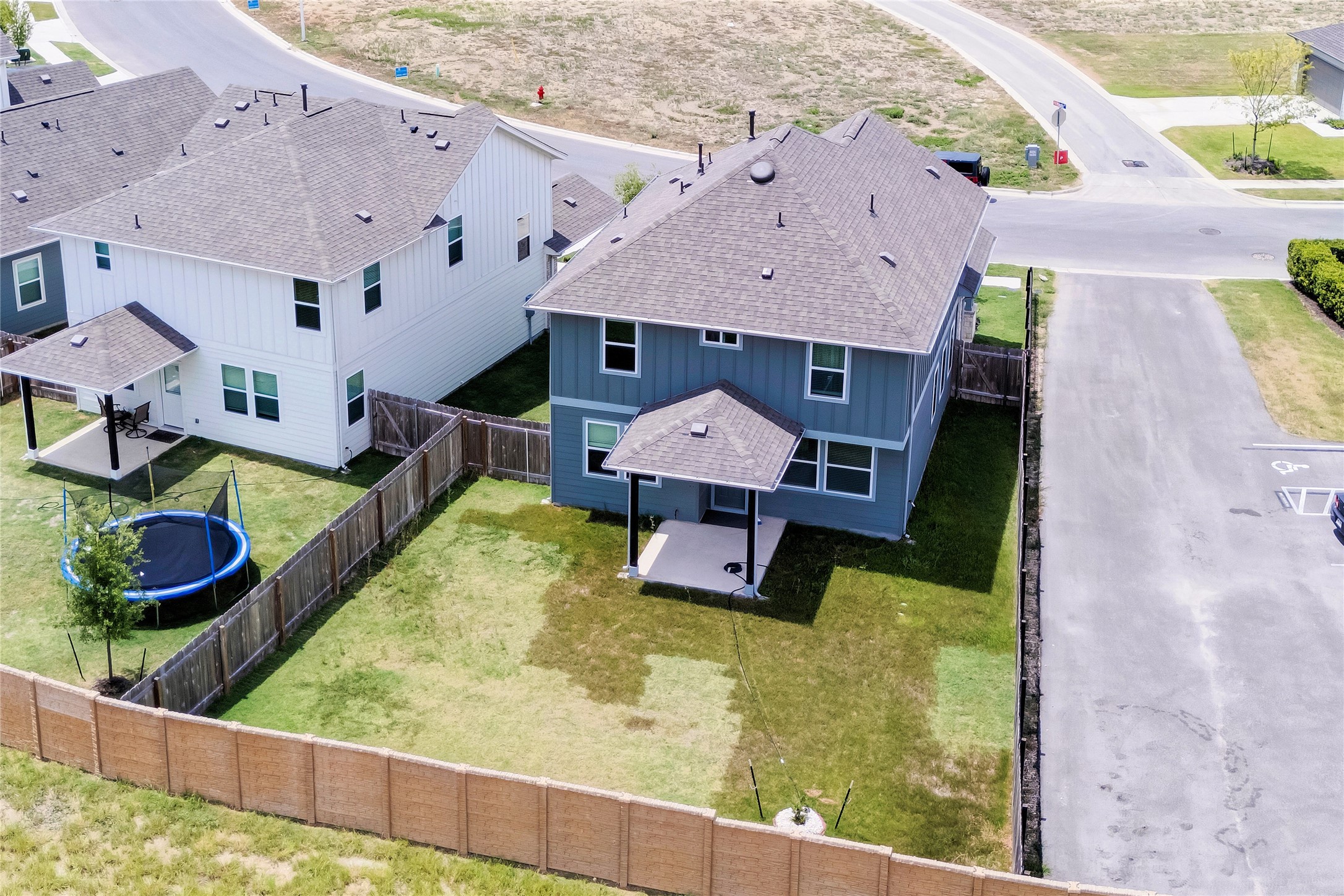 6554 Marsh Lane Buda, TX 78610 - Photo 19 of 30 an aerial view of house with yard and large trees