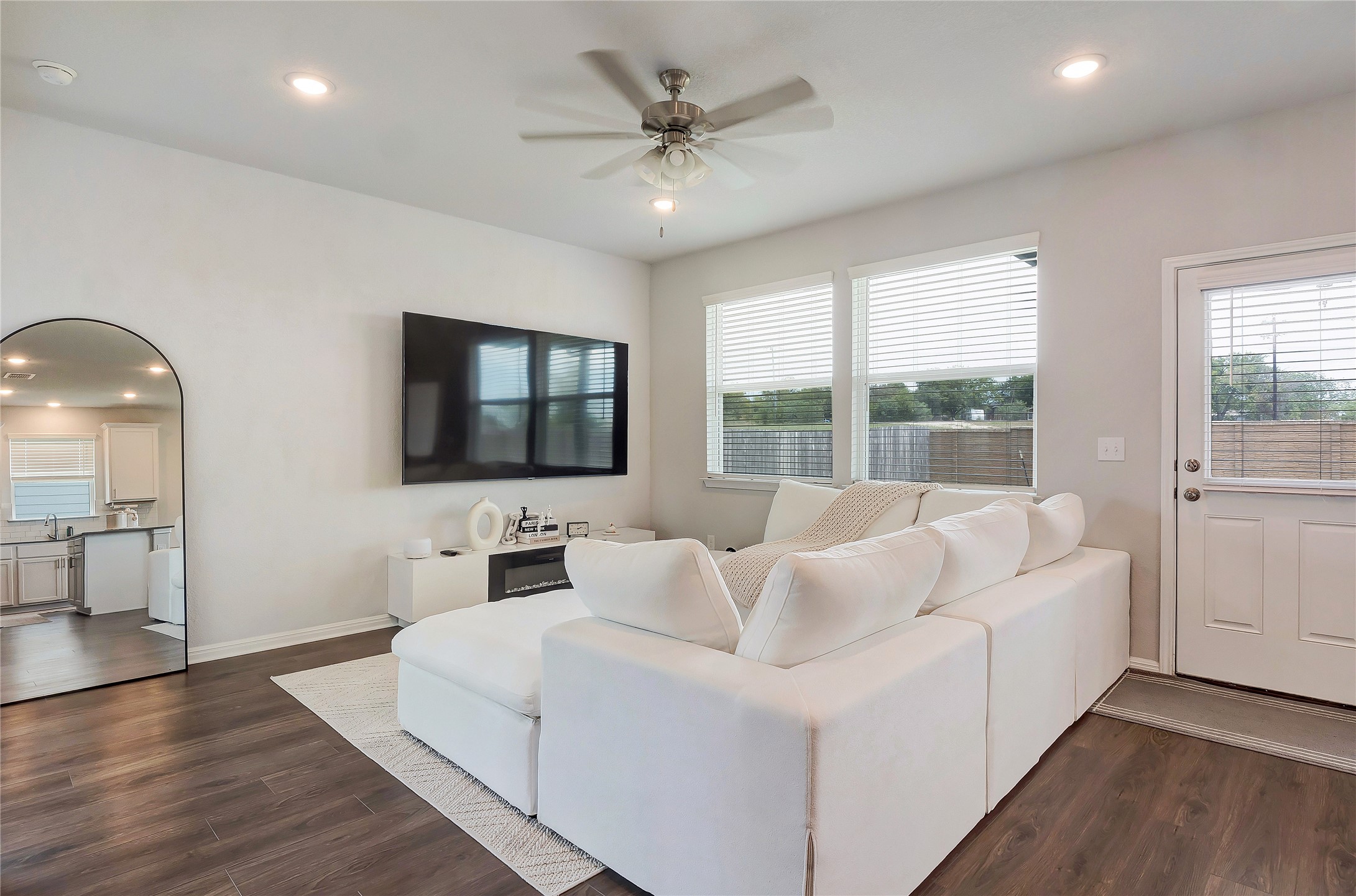 6554 Marsh Lane Buda, TX 78610 - Photo 5 of 30 a living room with furniture and a flat screen tv