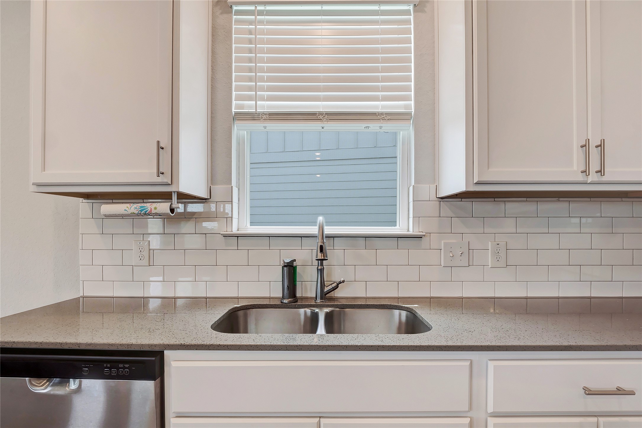 6554 Marsh Lane Buda, TX 78610 - Photo 8 of 30 a kitchen with a sink and cabinets