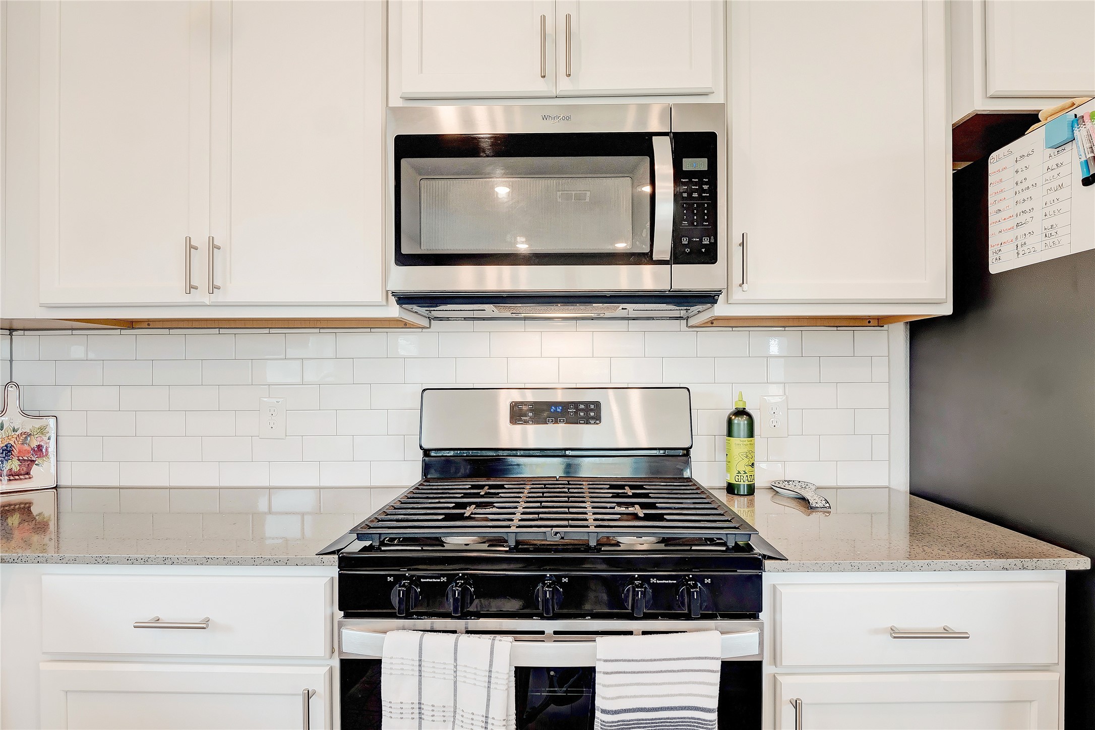 6554 Marsh Lane Buda, TX 78610 - Photo 9 of 30 a stove top oven sitting inside of a kitchen