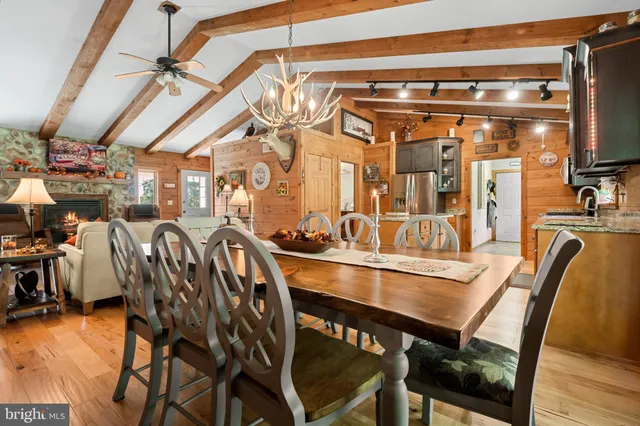 a kitchen with stainless steel appliances kitchen island granite countertop a refrigerator and cabinets