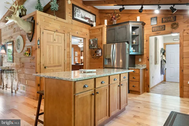 a dining table with chairs and window