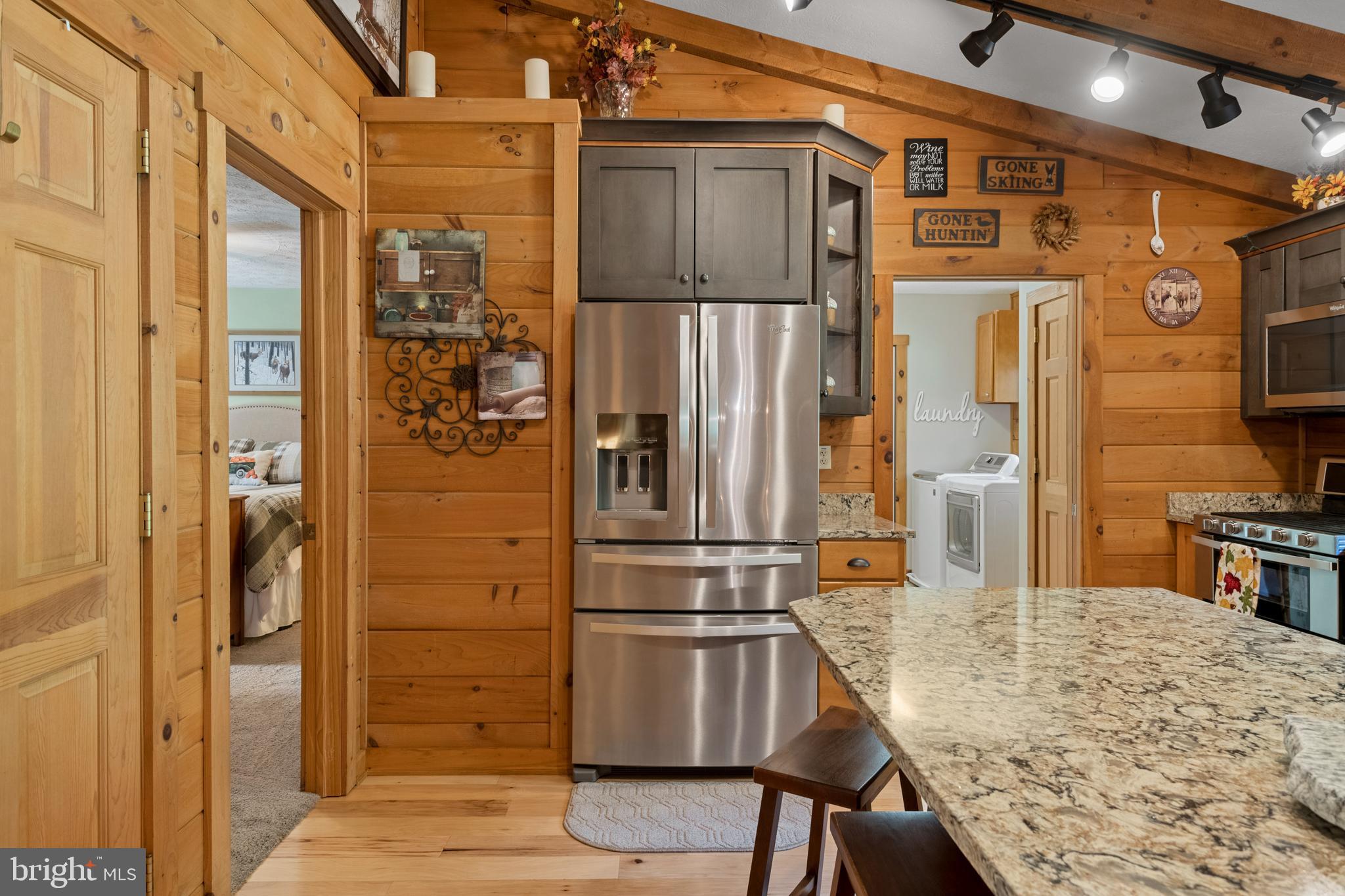 1967 Pinetown Road Wellsville, PA 17365 - Photo 15 of 58 a kitchen with stainless steel appliances kitchen island granite countertop a refrigerator and cabinets