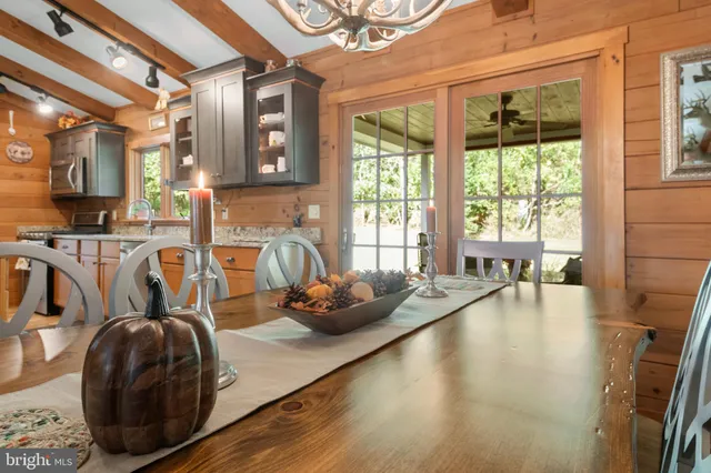 a room with a bed and a chandelier