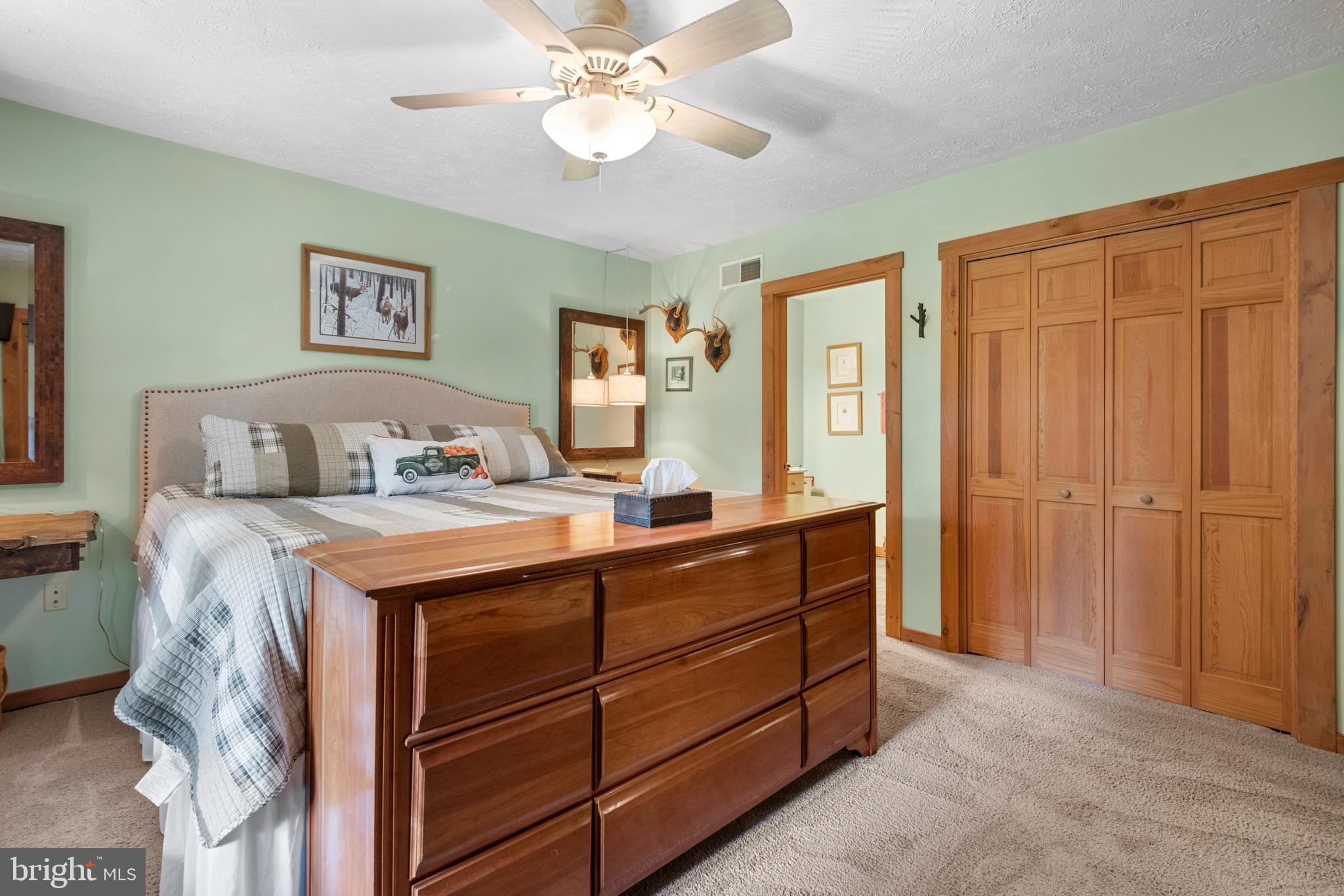 1967 Pinetown Road Wellsville, PA 17365 - Photo 21 of 58 a room with a bed and a chandelier