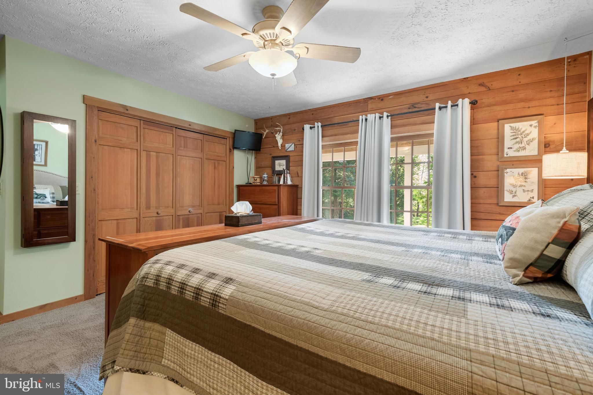 1967 Pinetown Road Wellsville, PA 17365 - Photo 22 of 58 a bedroom with a large bed and a large window