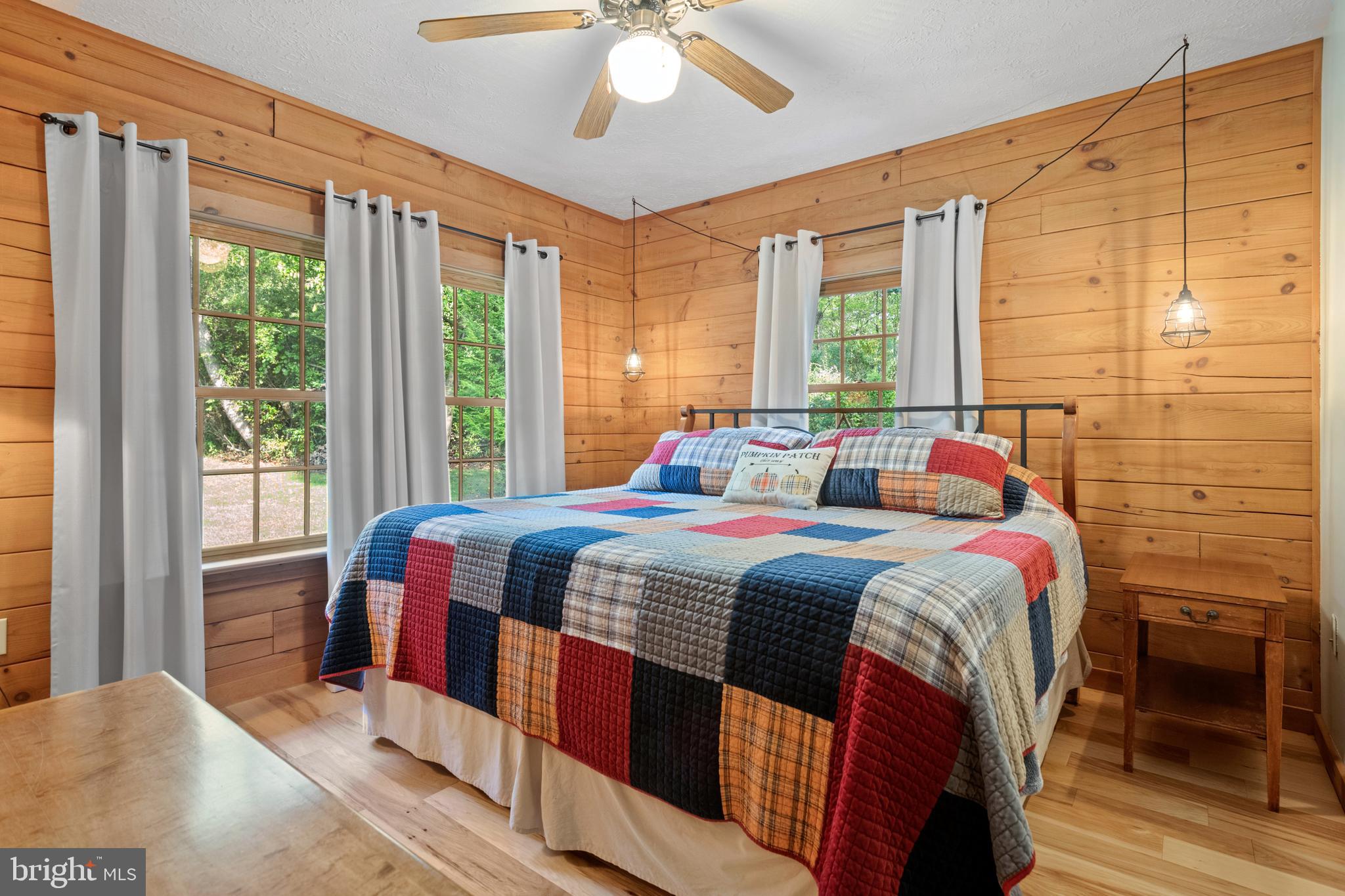 1967 Pinetown Road Wellsville, PA 17365 - Photo 24 of 58 a bedroom with a bed and a chandelier