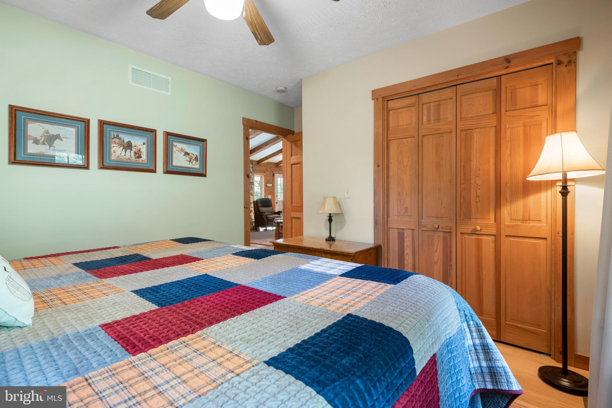 1967 Pinetown Road Wellsville, PA 17365 - Photo 25 of 58 a bedroom with a bed and a lamp