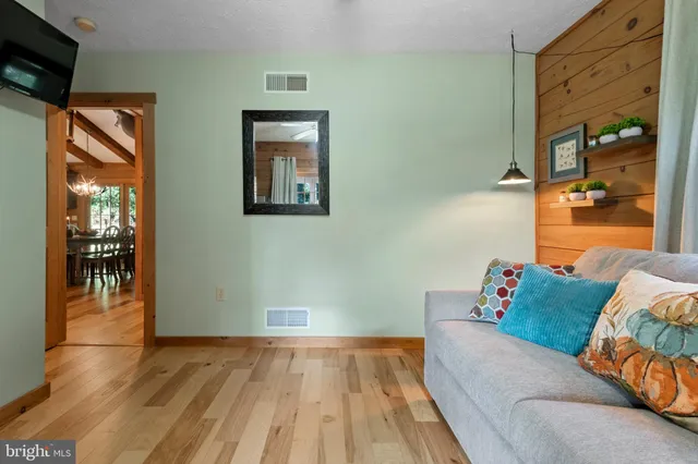 a view of a patio with a table chairs and a backyard