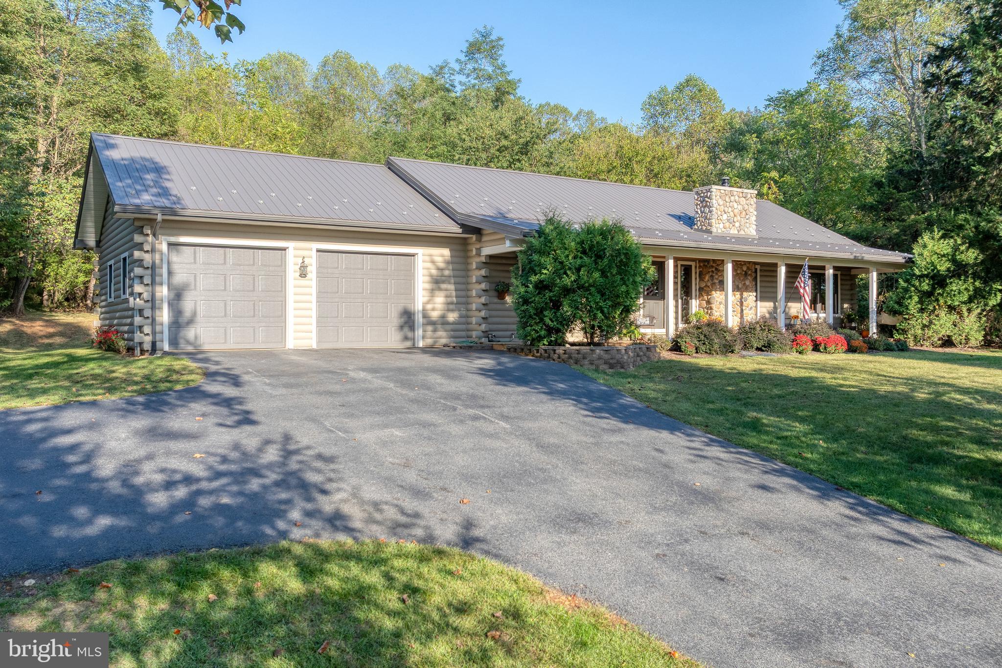 1967 Pinetown Road Wellsville, PA 17365 - Photo 39 of 58 a front view of a house with a garden