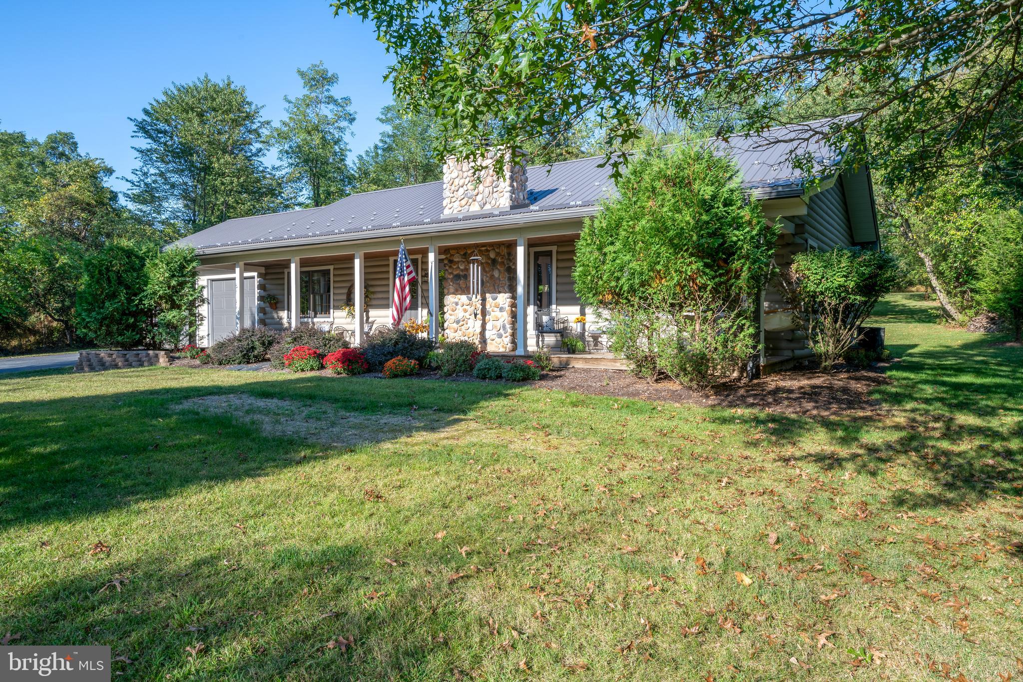 1967 Pinetown Road Wellsville, PA 17365 - Photo 44 of 58 a front view of a house with garden