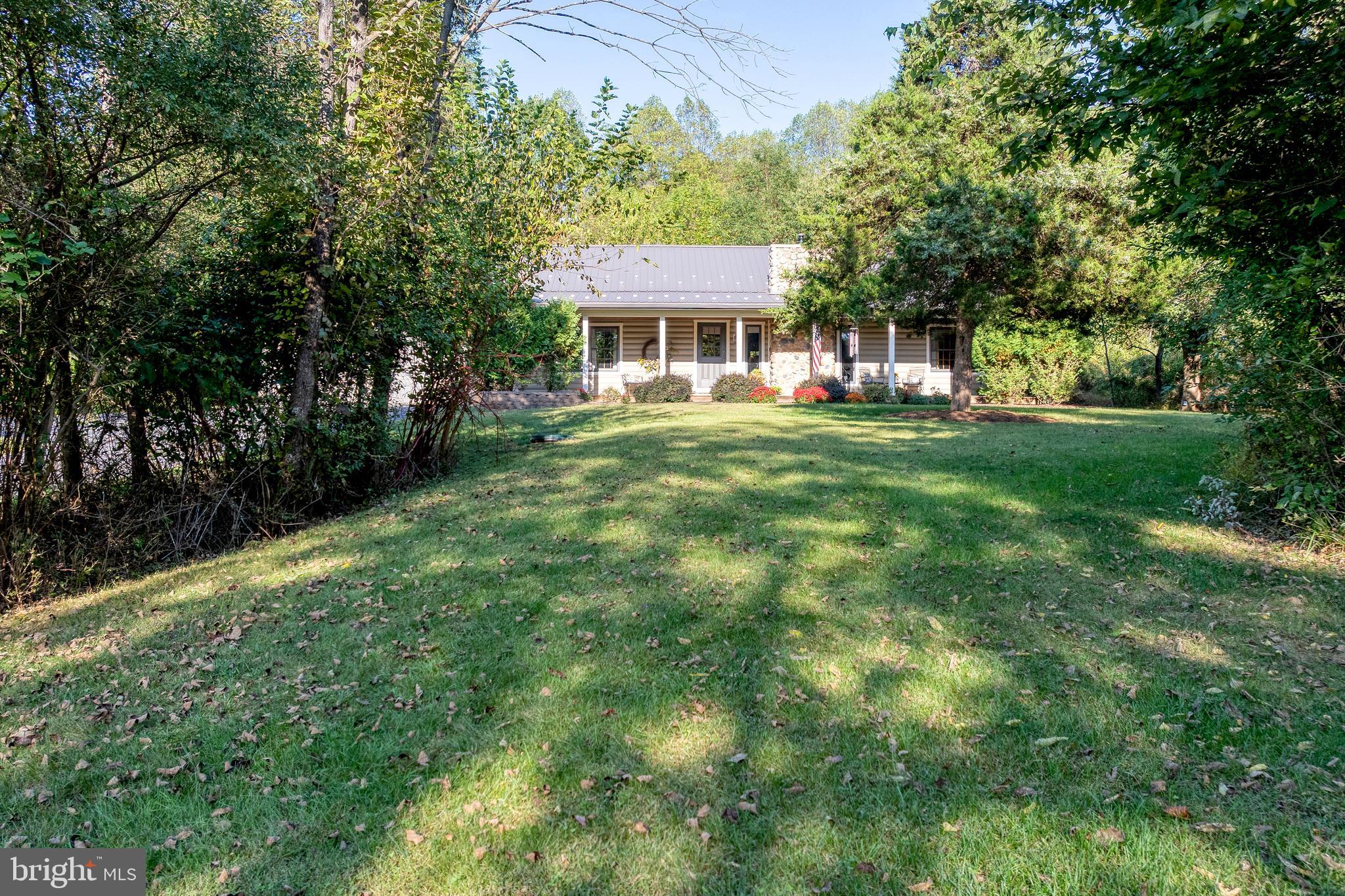 1967 Pinetown Road Wellsville, PA 17365 - Photo 45 of 58 a front view of a house with a garden