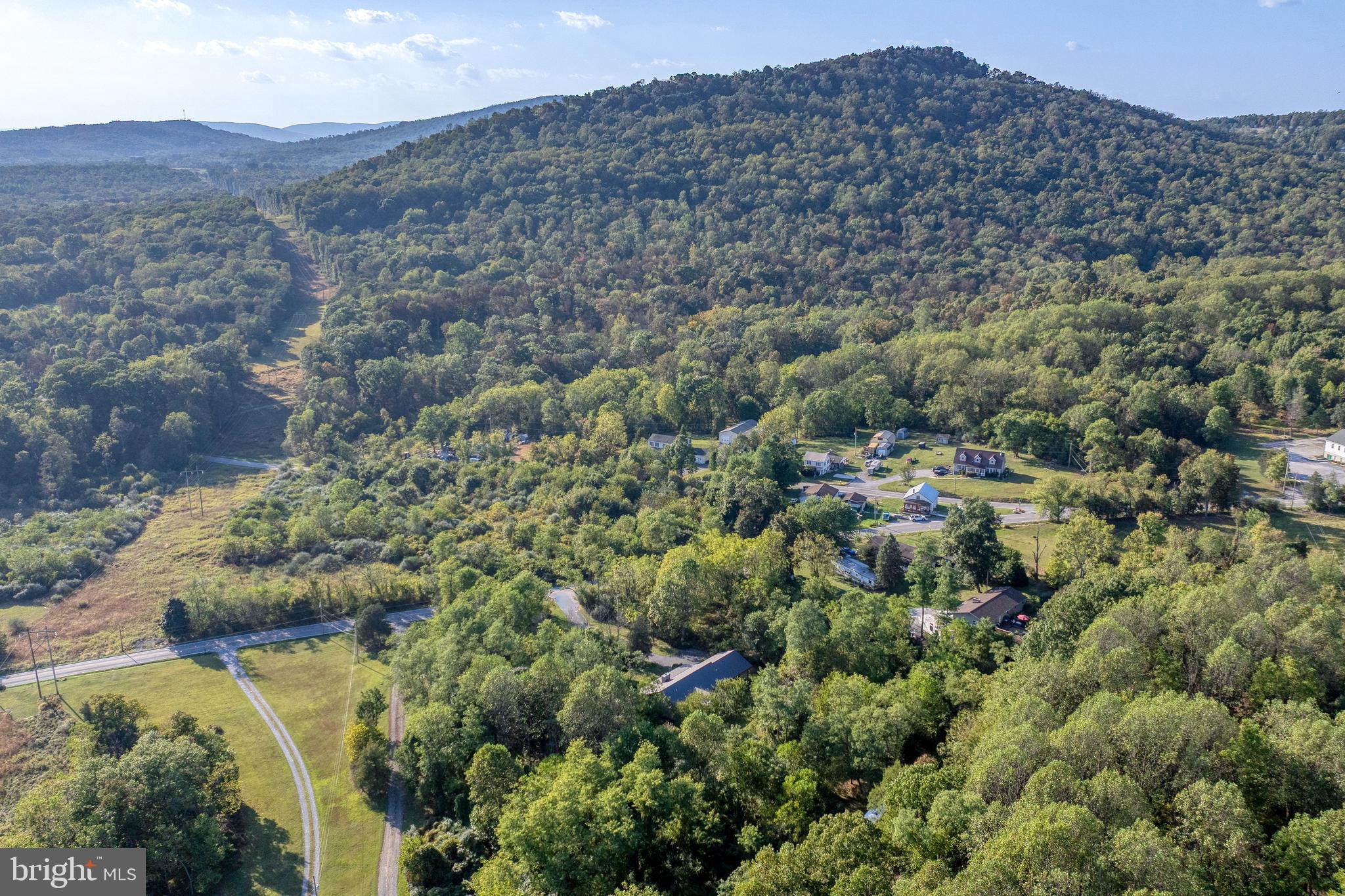 1967 Pinetown Road Wellsville, PA 17365 - Photo 53 of 58 an aerial view of a houses with a lush green hillside