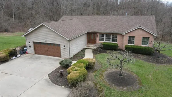 a house view with a backyard space