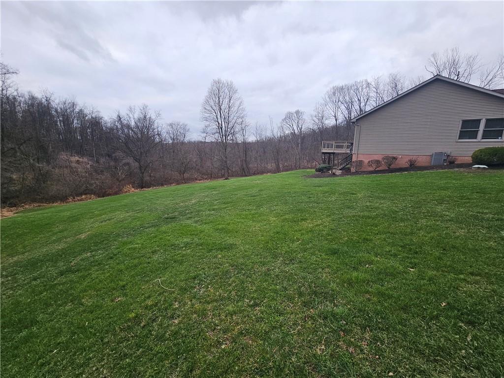 225 Profio Road McDonald, PA 15057 - Photo 15 of 49 a backyard of a house with lots of green space