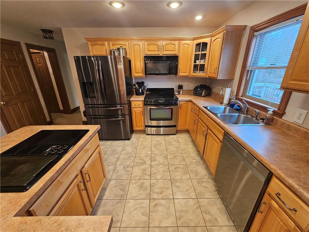 225 Profio Road McDonald, PA 15057 - Photo 18 of 49 a kitchen with stainless steel appliances a stove microwave and a refrigerator