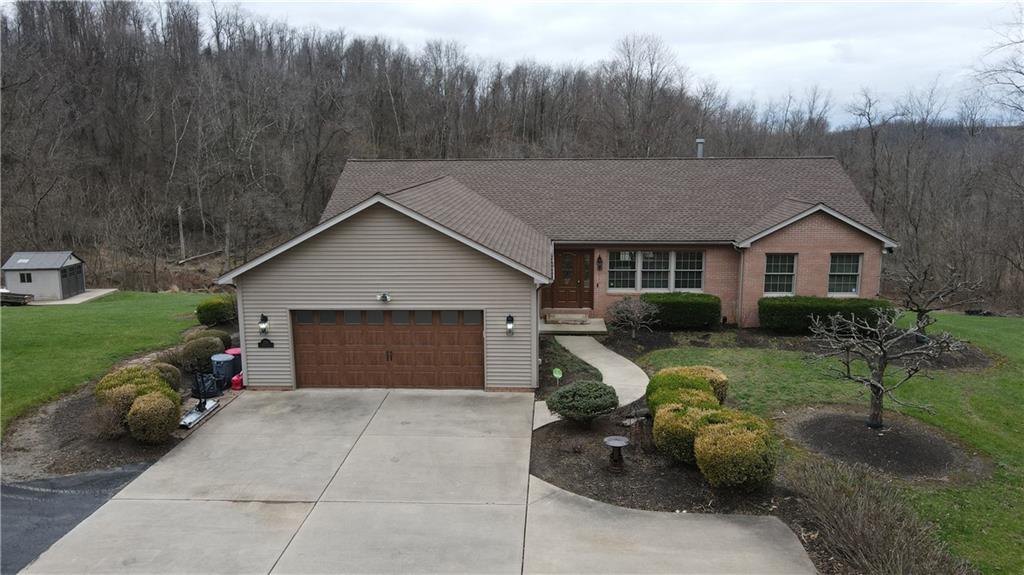 225 Profio Road McDonald, PA 15057 - Photo 2 of 49 a view of a house with backyard and garden