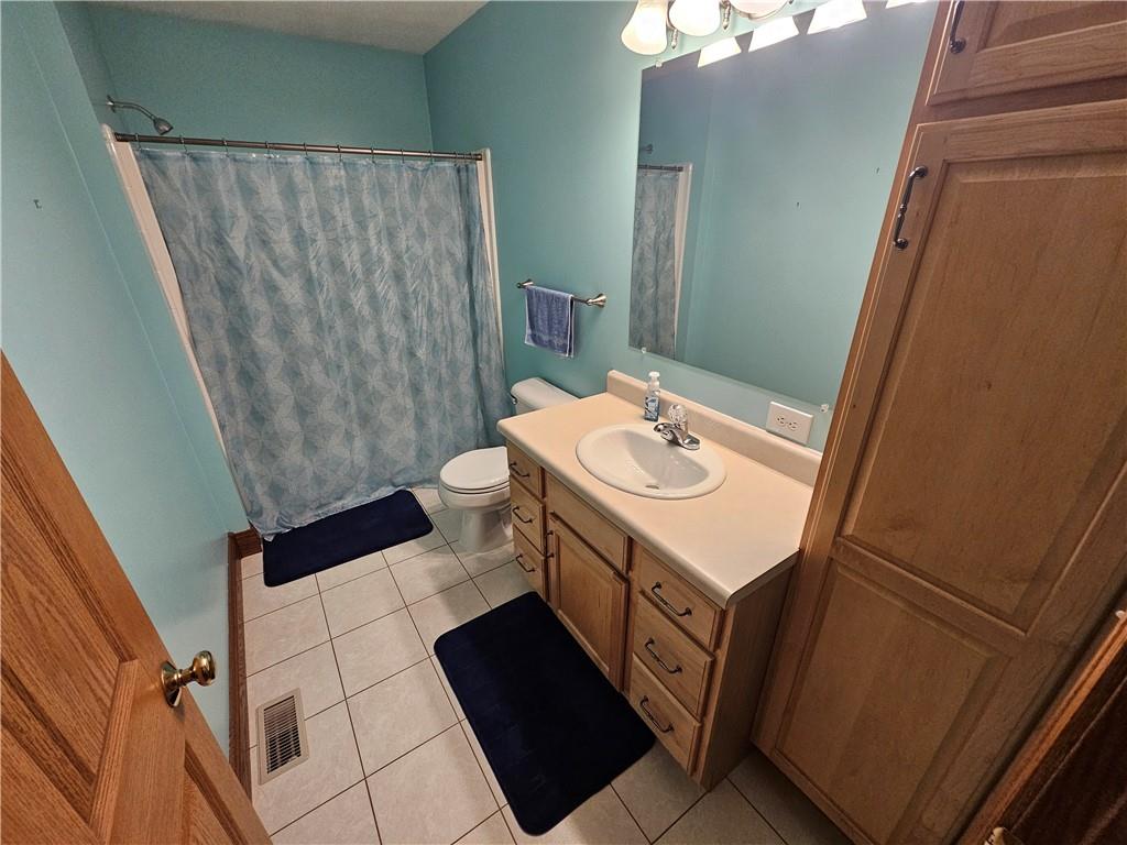 225 Profio Road McDonald, PA 15057 - Photo 27 of 49 a bathroom with a sink a toilet a mirror and shower