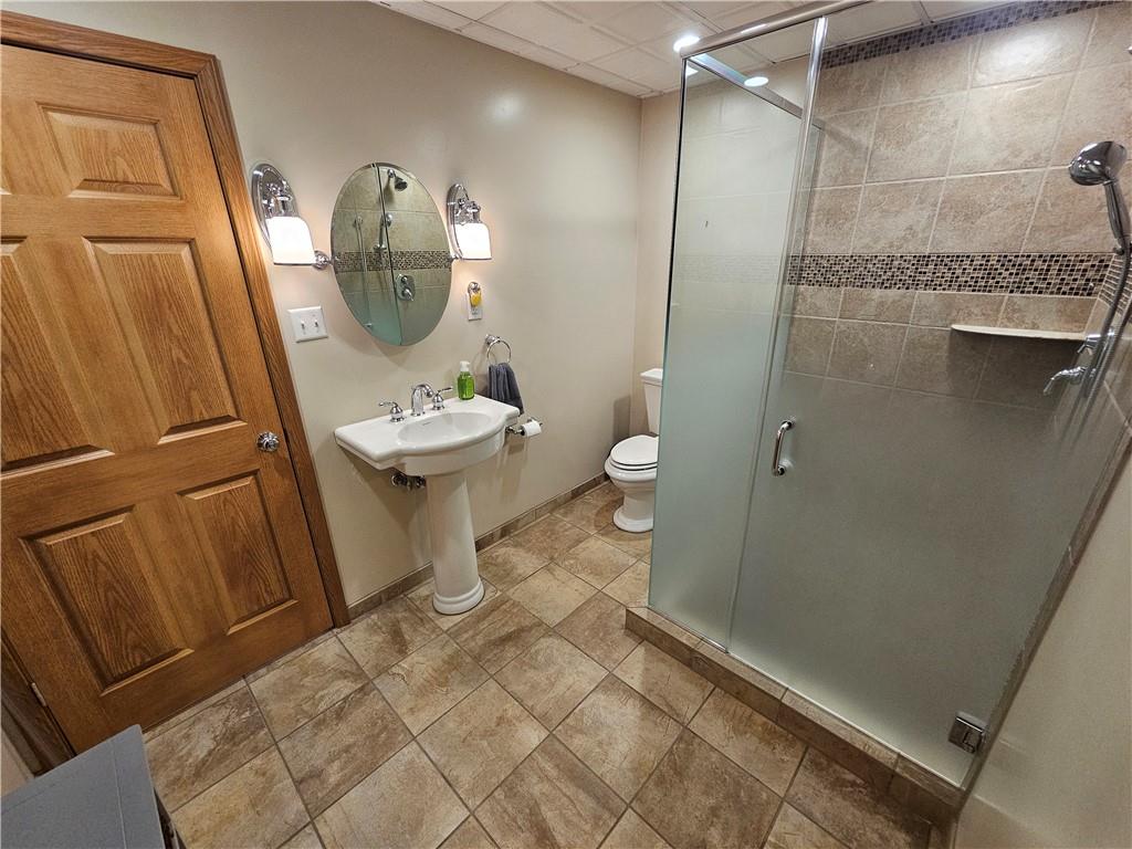 225 Profio Road McDonald, PA 15057 - Photo 32 of 49 a bathroom with a sink a toilet and a mirror