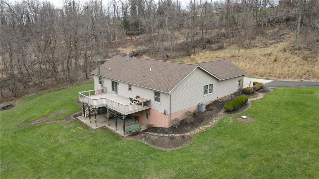 225 Profio Road McDonald, PA 15057 - Photo 4 of 49 a aerial view of a house with a yard table and chairs