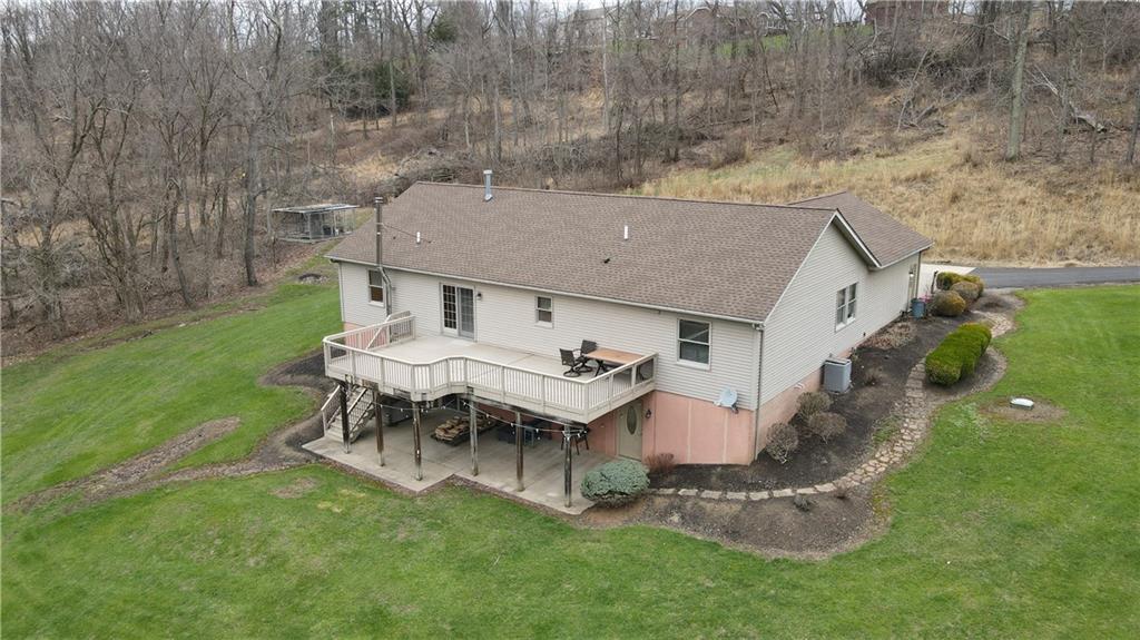 225 Profio Road McDonald, PA 15057 - Photo 5 of 49 a aerial view of a house with a yard and sitting area