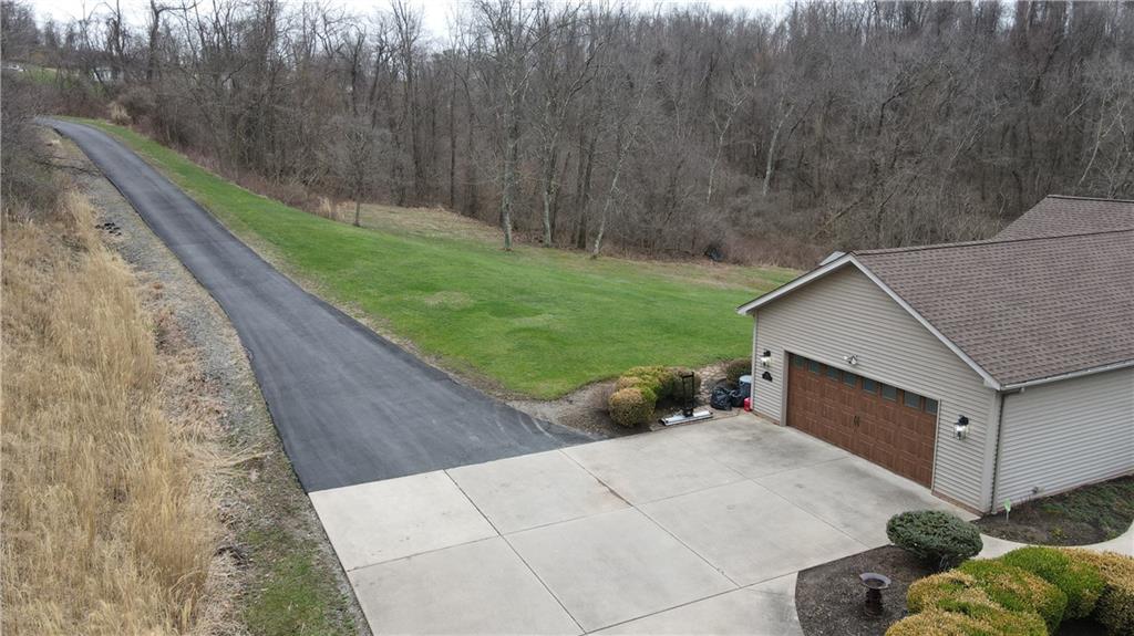 225 Profio Road McDonald, PA 15057 - Photo 7 of 49 a backyard of a house with lots of green space