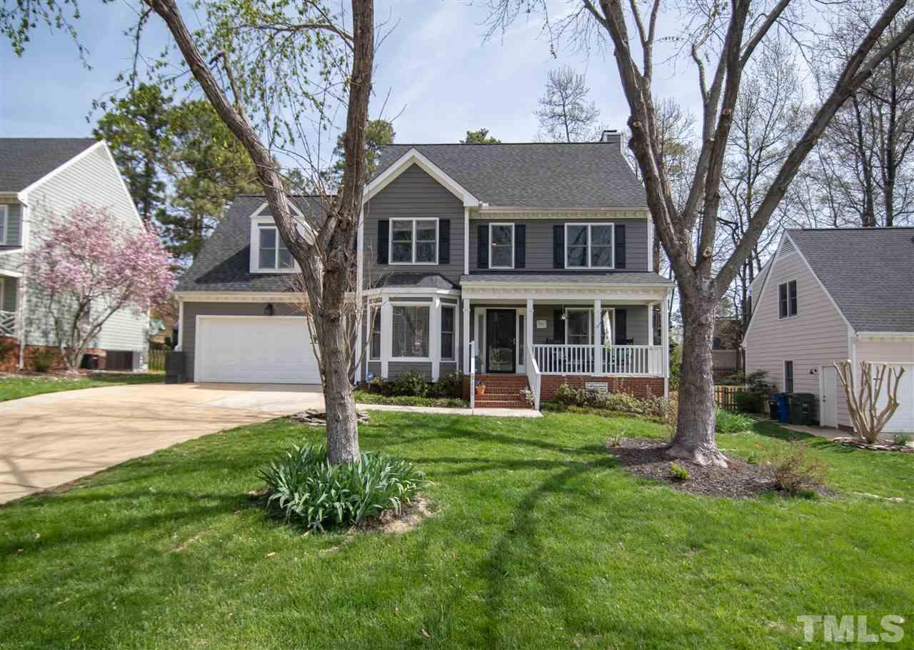 9116 Dawnshire Road Raleigh, NC 27615 - Photo 1 of 30 a front view of a house with a yard and garage