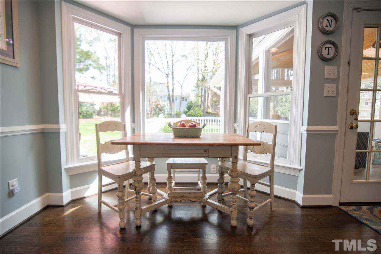 9116 Dawnshire Road Raleigh, NC 27615 - Photo 15 of 30 a dining room with furniture window wooden floor