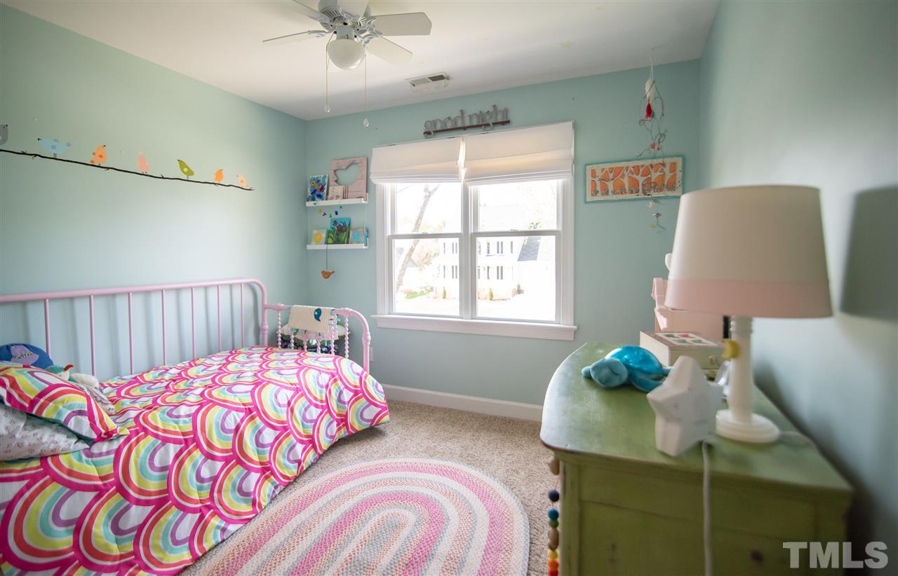 9116 Dawnshire Road Raleigh, NC 27615 - Photo 19 of 30 a bedroom with a bed and a window