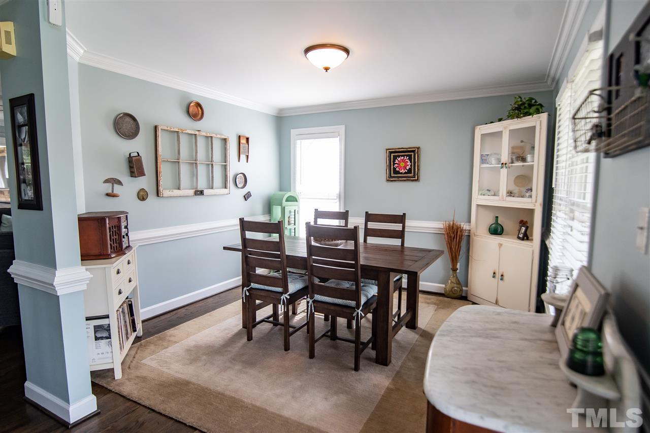 9116 Dawnshire Road Raleigh, NC 27615 - Photo 5 of 30 a view of a livingroom with furniture and a workspace
